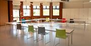 Internal shot of the Dulverton Room, showing chairs and tables set for a meeting