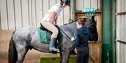 Riders at Fort Widley Equestrian Centre