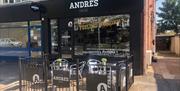 The exterior of Andre's in Drayton, with outdoor seating