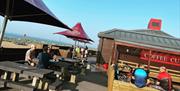 Outside seating and parasols at Eastney Coffee Cup