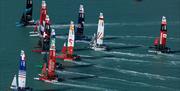 A close pack of race boats during a SailGP event