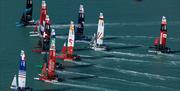 A close pack of race boats during a SailGP event