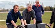 Three men with equipment at a Field Gun Team Experience Day