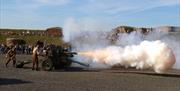 Gun firing on the Fort Nelson Parade Ground