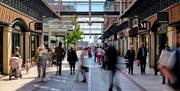 Shoppers in the avenues at Gunwharf Quays