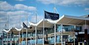 A Gunwharf Quays flag flying near the centre's restaurants