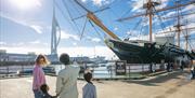 Family looking out at HMS Warrior