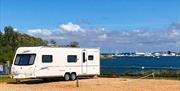 Touring caravan pitched up at Fishery Creek Park