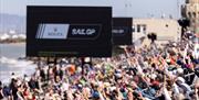 Crowds at the water's edge for a SailGP event