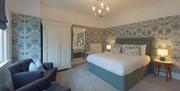 A double room with additional seating options at Florence House Boutique Hotel and Restaurant