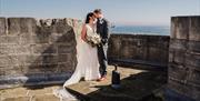 A newlywed couple at the Square Tower