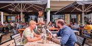 Two people dining al fresco at Pizza Express in Gunwharf Quays