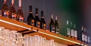 A selection of wine and fizz on a shelf at Pizza Express in Gunwharf Quays