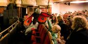 A children's event featuring interactive puppetry at New Theatre Royal