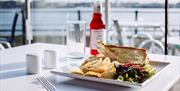 Enjoy a spot of lunch with a seafront view at The Waterfront Cafe