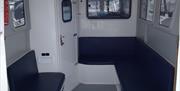 Indoor seating area aboard Dointhedo