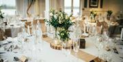 A table dressed for a wedding reception at Skylarks Country Club