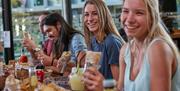 Group of friends eating in at Tortilla