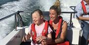 People enjoying a trip on Wetwheels Solent