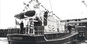 A black and white photograph of 'Sir William Arnold' at port