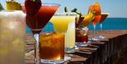 A line up of cocktails on the walls of Southsea Castle ramparts