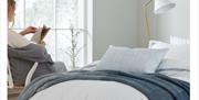 Murmur press shot - white and blue bedding