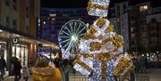 Lighting display in the shape of a pile of gifts at Gunwharf Quays