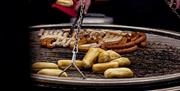 Bratwurst cooking at the Gunwharf Quays Christmas Village