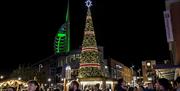 Christmas tree at Gunwharf Quays with the Spinnaker Tower in the background