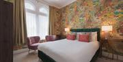 A warm and cosy bedroom at Somerset House Boutique Hotel and Restaurant