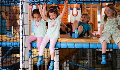 Children enjoying the climbing activities at Exploria