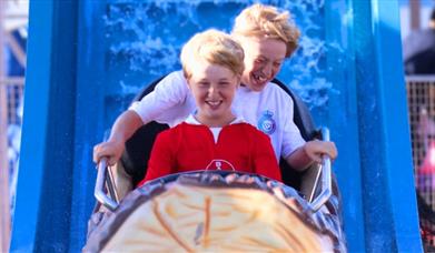 People enjoying the rides at Clarence Pier Amusement Park