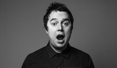 Black and white photograph of Paul McCaffrey