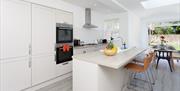 Light and airy kitchen diner at an Oliverball Serviced Apartment