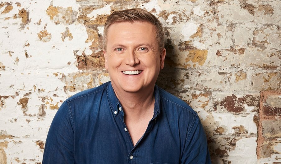 Press photo for Aled Jones: Full Circle featuring the singer against a bare brick wall