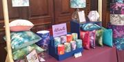 Craft stall selling cushions, lampshades and candles