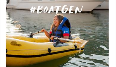 Girl in a dinghy enjoying a Boatgen day