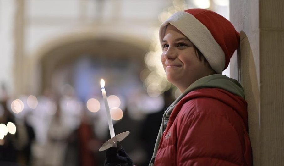 A young person at one of Portsmouth Cathedral's Christmas Carol Services