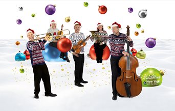 Members of the Bournemouth Symphony Orchestra dressed in Christmas jumpers