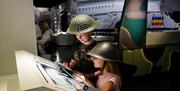 Children enjoying the exhibits and displays at The D-Day Story