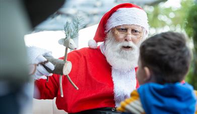 Santa Claus with a child at Port Solent’s Festival of Christmas