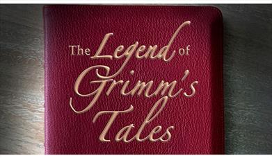 Leather book inscribed with the words The Legend of Grimm's Tales