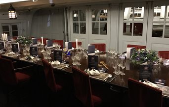 HMS Victory's Great Cabin, set up for food and drinks