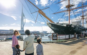 Family looking out at HMS Warrior