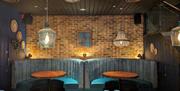 Two booth seating areas at Gunwharf Quays' Tap & Tandoor Portsmouth