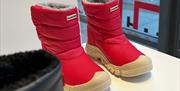 Red Hunter boots in the window of its Gunwharf Quays outlet