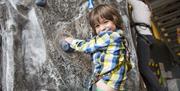 Child climbing at Action Stations