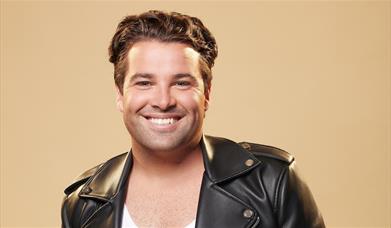 Press shot for Freedom, with Joe McElderry wearing a George Michael-style leather jacket