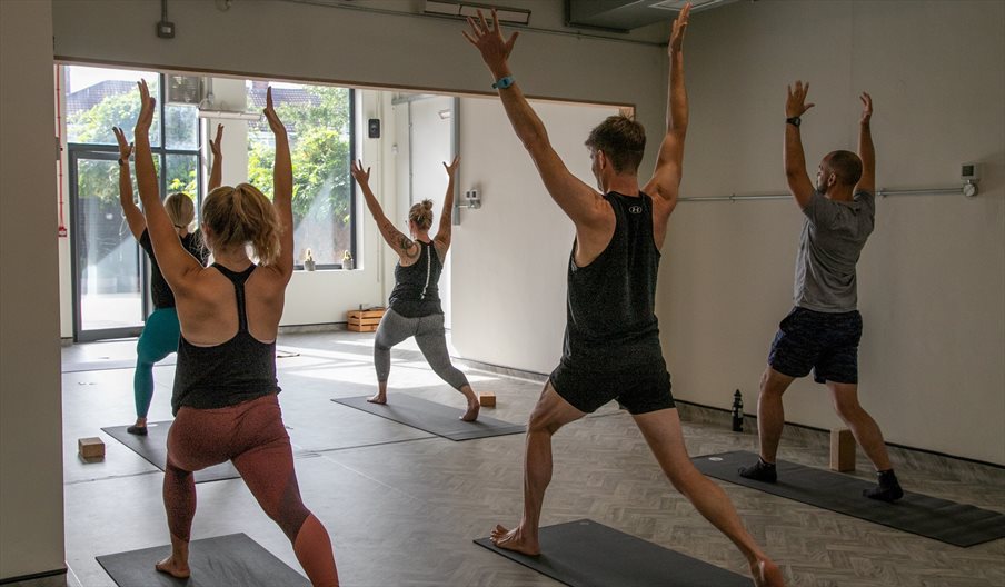 Five people taking part in a Yoga session at LANO Yoga in Southsea