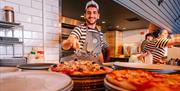 A chef plates up a dish at Pizza Express in Gunwharf Quays